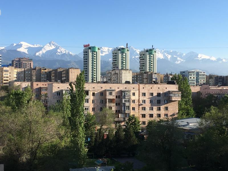 An apartament building in the trees.